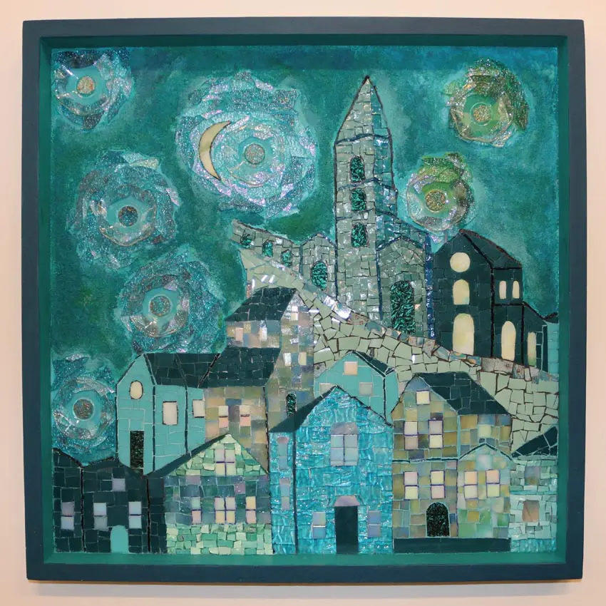 square turquoise mosaic artwork featuring a village at night