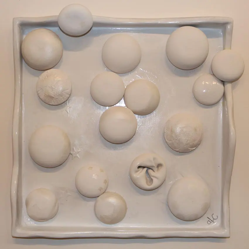 square porcelain white artwork featuring round drops