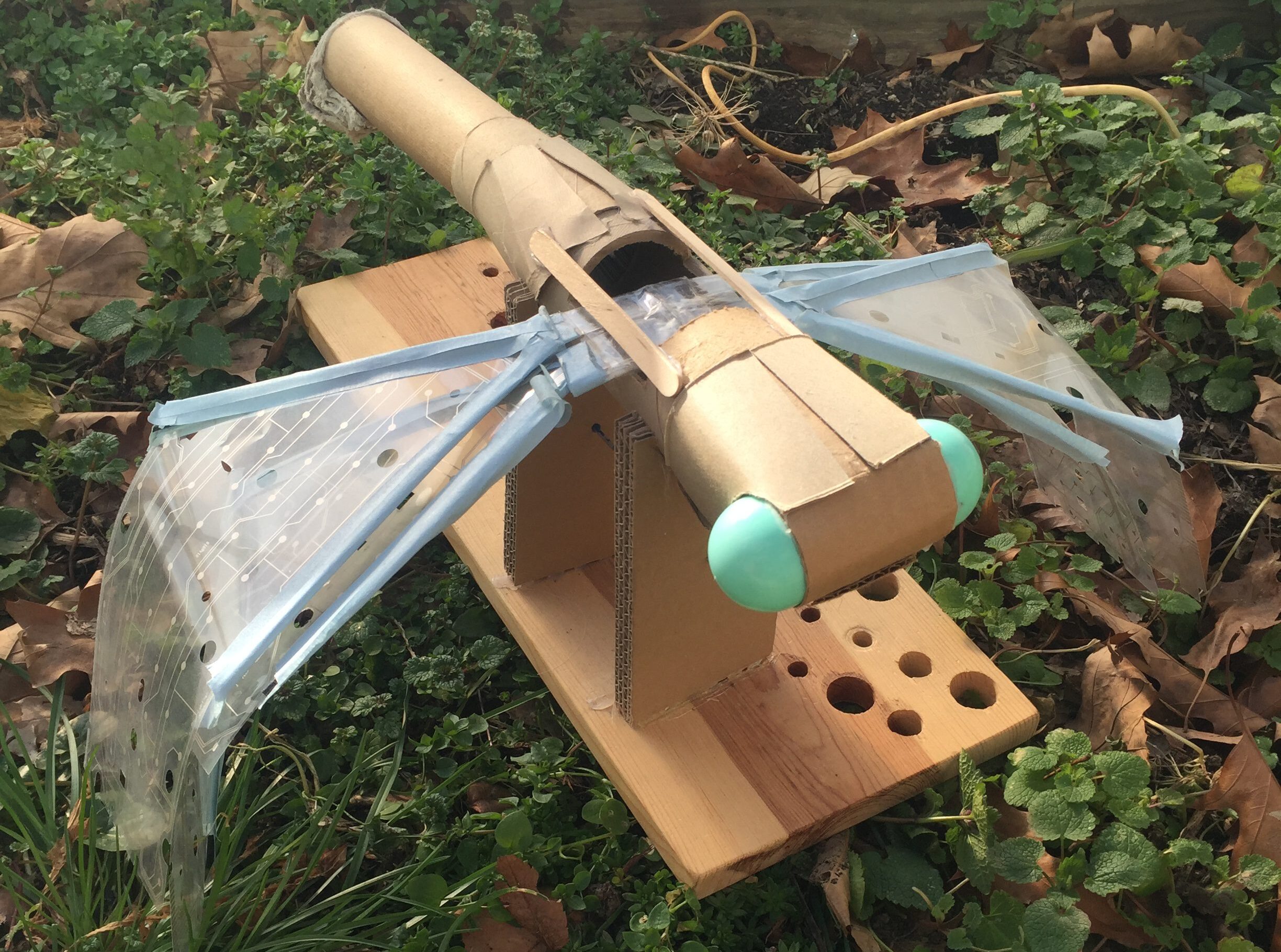 A sculpture of a dragonfly made from recycled materials.