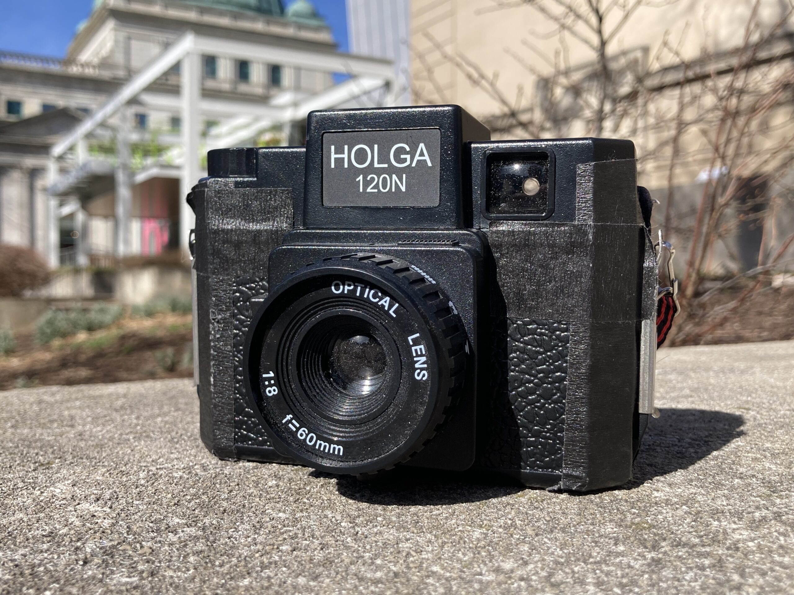 A Holga film camera sits outside in front of the Children's Museum.