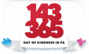 Logo for 143 Day of Kindness in PA with red lettering and two birds holding a banner